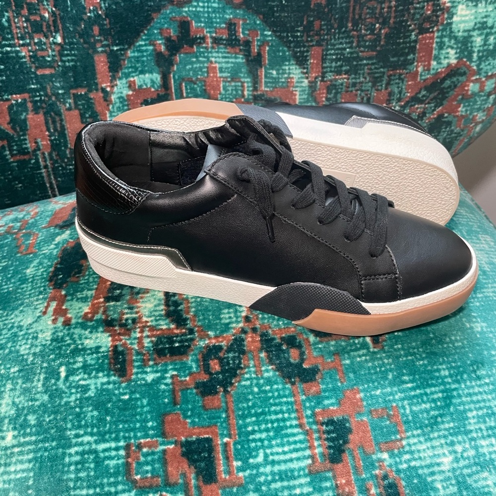 Dolce Vita New women’s black leather sneakers size  9 has tan silver on bottom